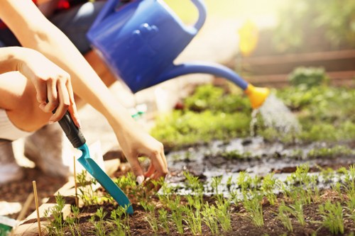 Team member preparing mower at a Shadwell garden